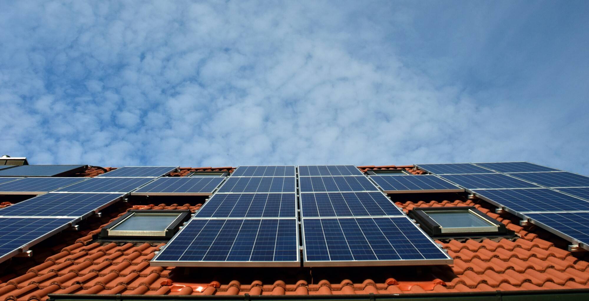 Solar panels and screens reducing heat on a home